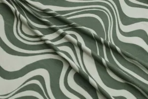 End of Bolt: 1-7/8th yards of  Retro Swirls Double Brushed Green Poly Spandex Knit- Remnant