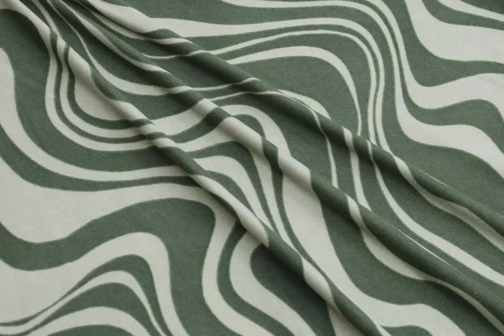 End of Bolt: 1-7/8th yards of  Retro Swirls Double Brushed Green Poly Spandex Knit- Remnant